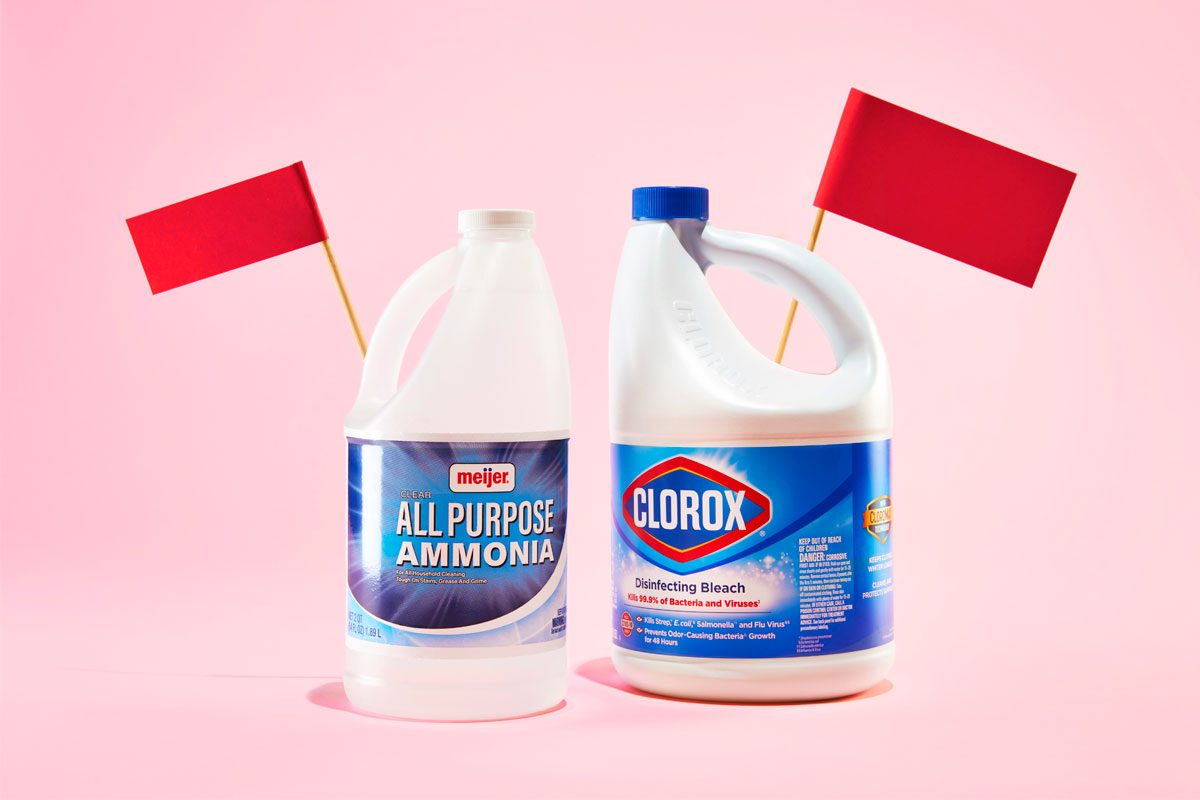 jugs of ammonia and bleach with red flags against a pink background
