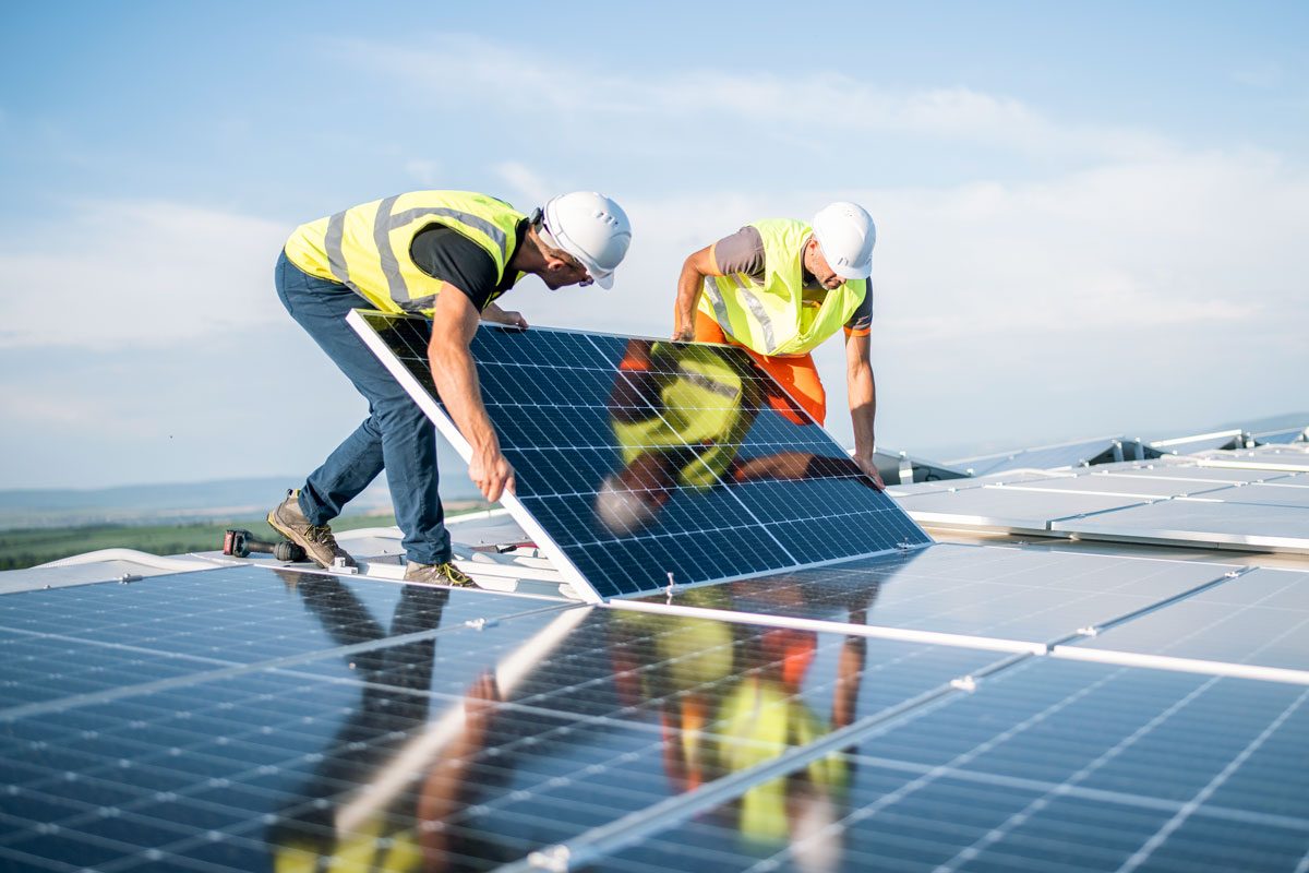 Two Workers Installing Solar Panels