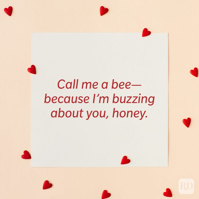 Valentine’s Day Pickup Line on paper background with scattered hearts around it background