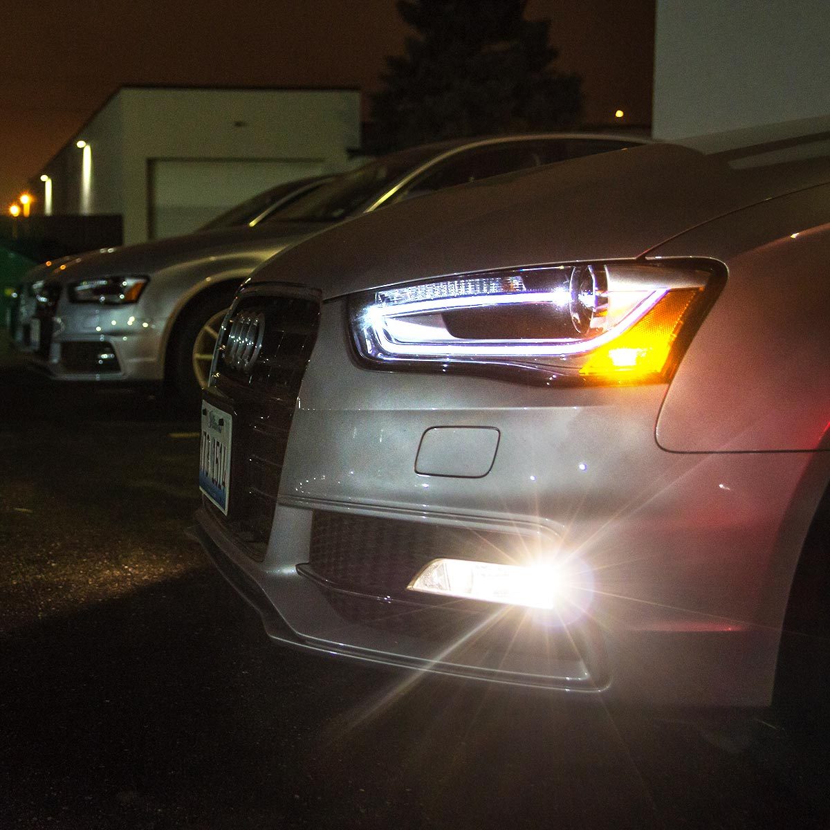 Close-up of a sedan's white LED headlights 