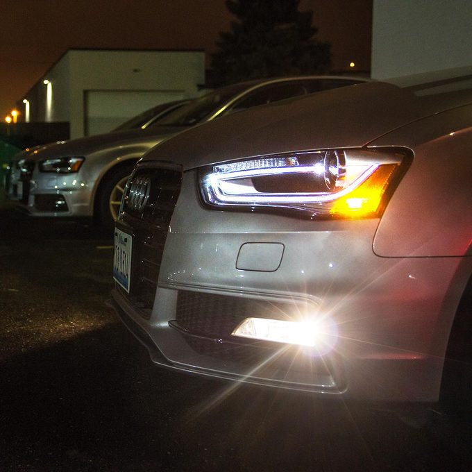 Close-up of a sedan's white LED headlights