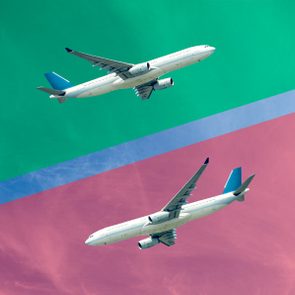 Two jet airplanes flying in opposite directions in a blue sky, with a green overlay on the top one and a red overlay on the bottom one