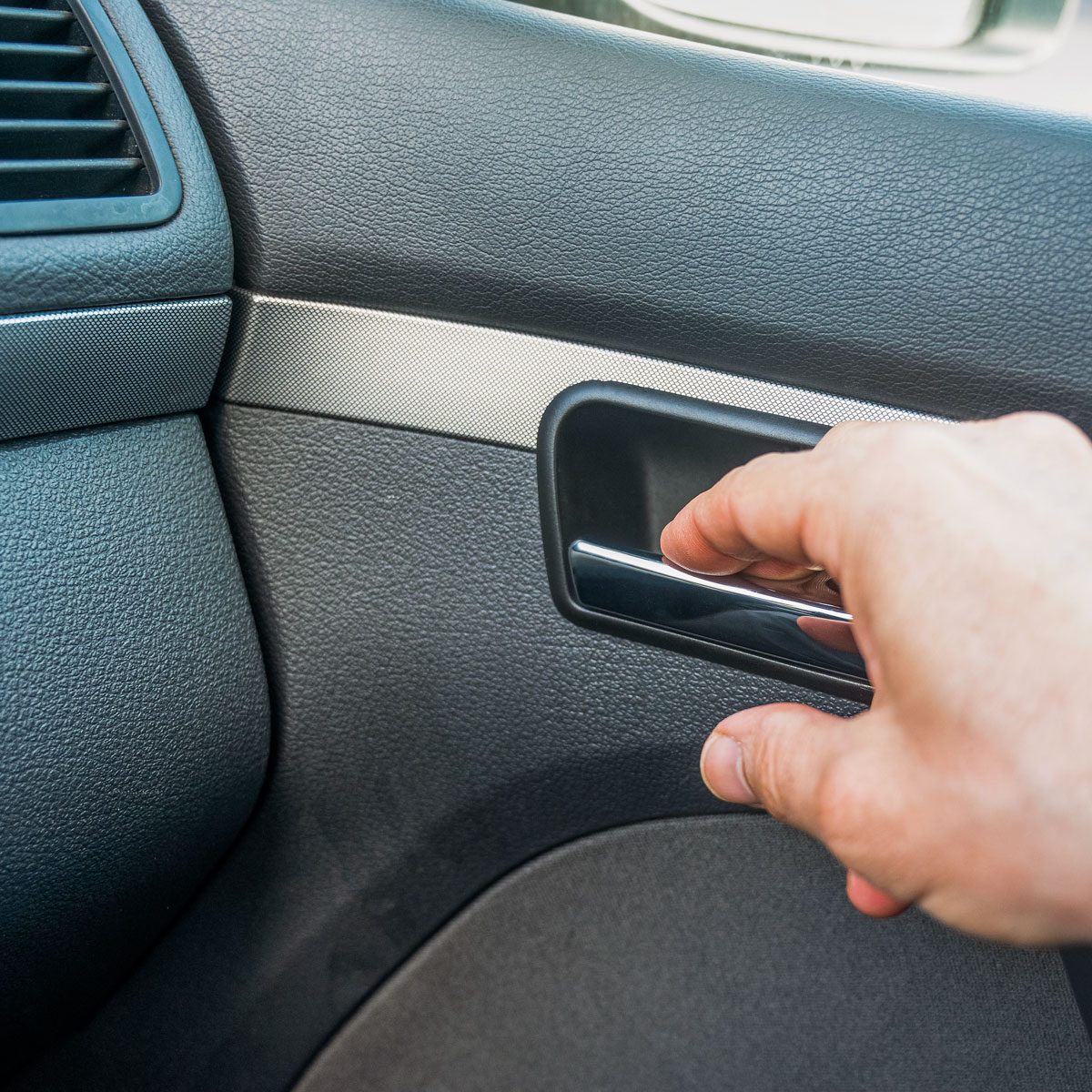 Man Opens A Car Door